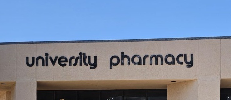 The University Pharmacy sign on the front of the building.